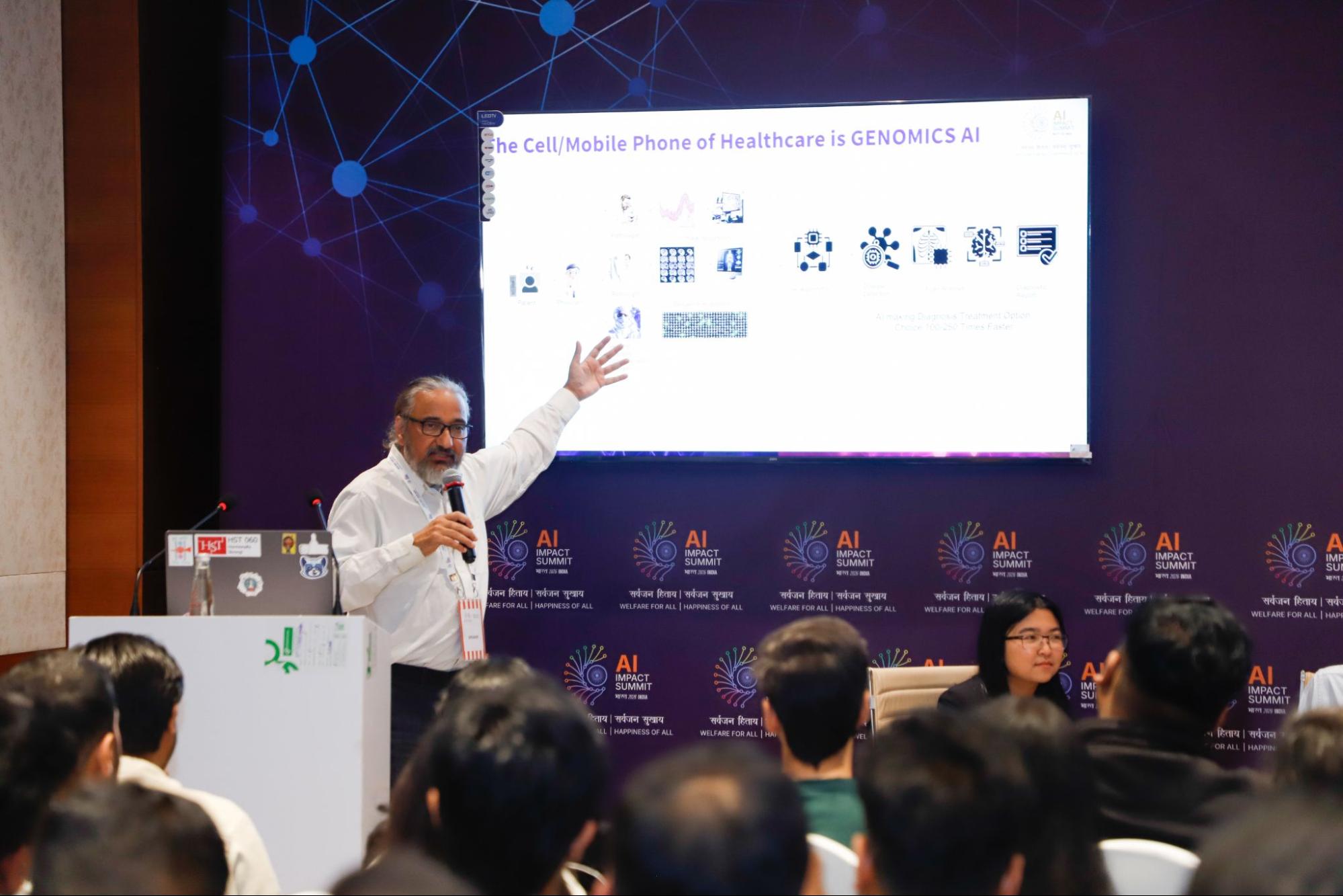 Speaker presenting on genomics AI at the India AI Impact Summit